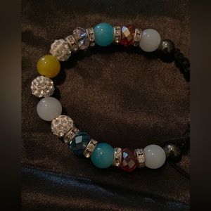 Multi colored adjustable size bead bracelet. Brand new